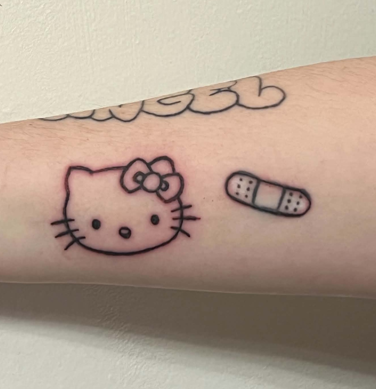 hello kitty and bandaid